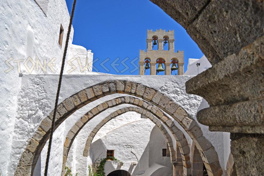 arched stone openings and bell tower of the Monastery of St. John the Theologian